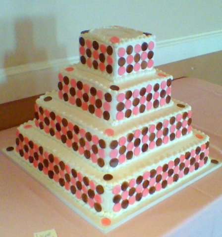 4 tier square with circles - Each circle is cut out of a sheet of fondant and is little bigger than an inch.